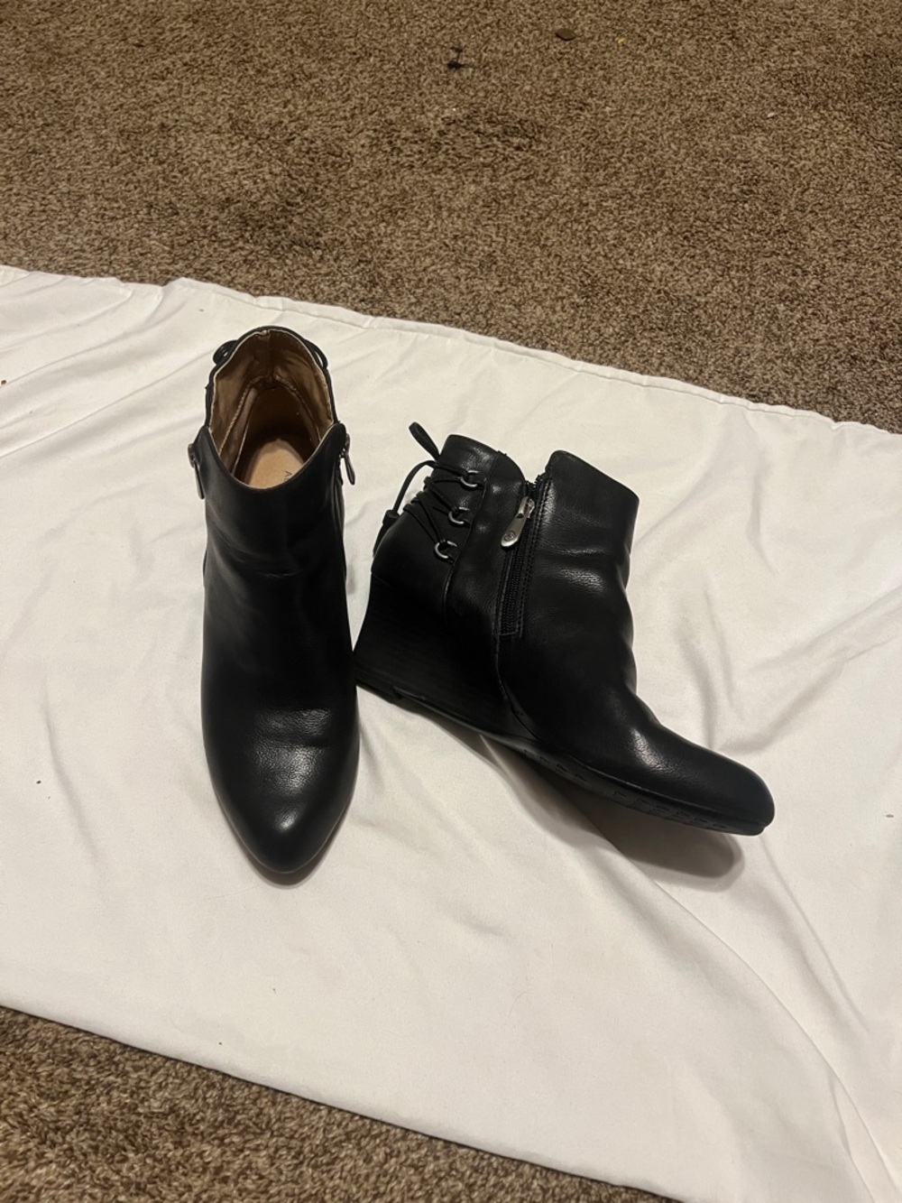 Adrienne Vittadini black leather booties. Zip closure   Never worn